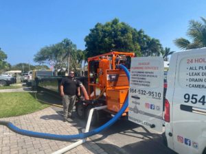 vac truck with technician